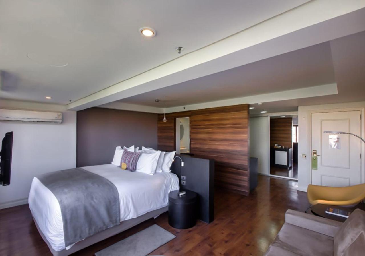 فندق راديسون بورتو أليجري بورتو أليغري المظهر الخارجي الصورة A bedroom at the hotel
